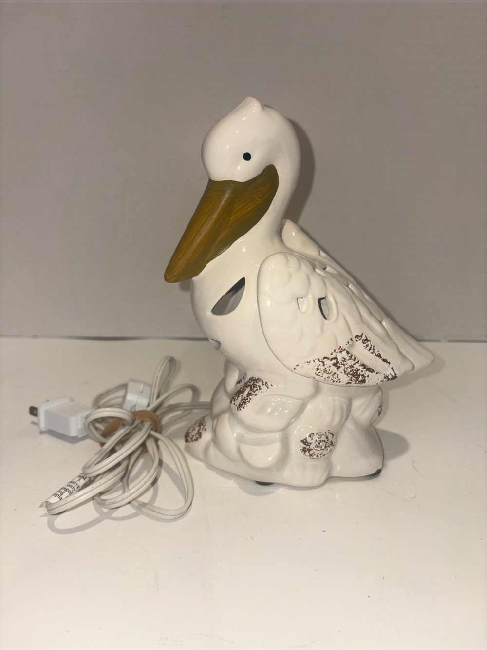 Kirklands White Ceramic Pelican Accent Night Light with Gold Beak
